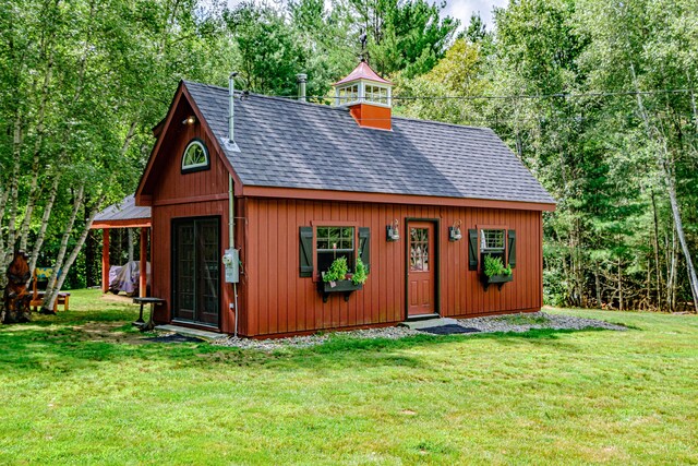 view of outdoor structure with a lawn