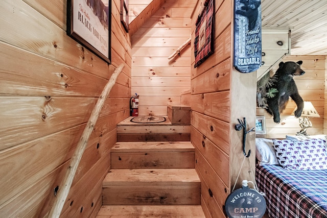 staircase with wooden walls