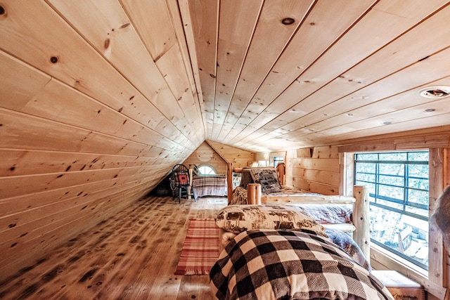 unfurnished bedroom with wood ceiling, wooden walls, lofted ceiling, and hardwood / wood-style floors