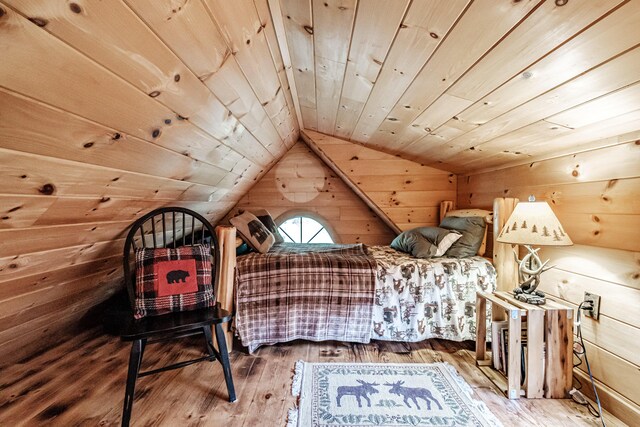 bedroom with lofted ceiling and wood ceiling