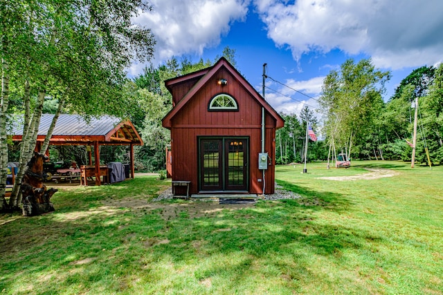 view of outbuilding with a lawn