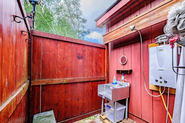 view of patio featuring water heater