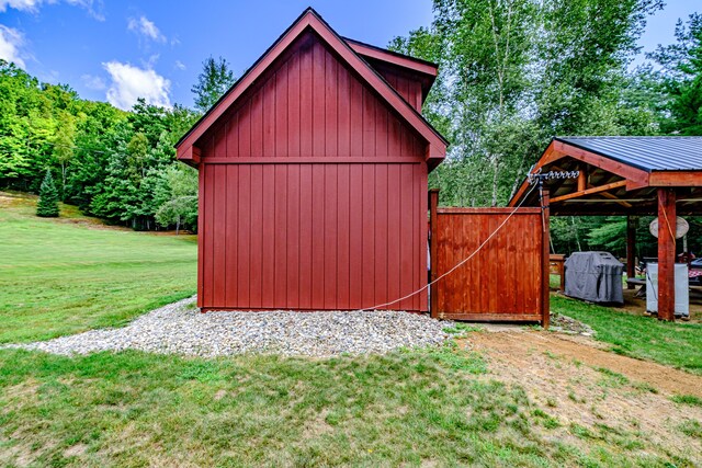 view of outdoor structure with a lawn