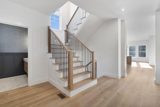 stairway featuring hardwood / wood-style flooring