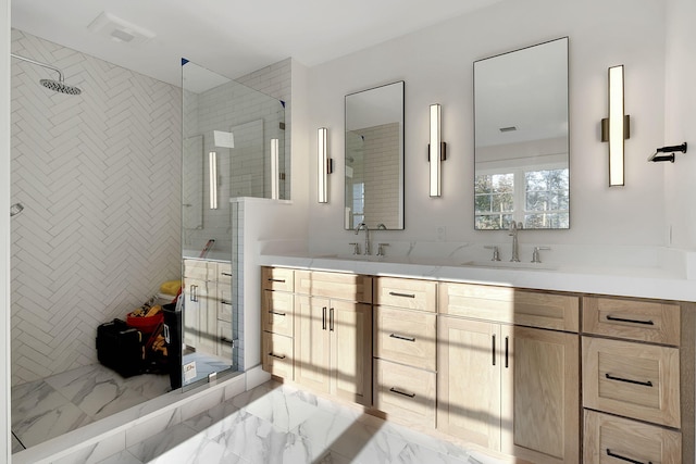 bathroom featuring vanity and tiled shower