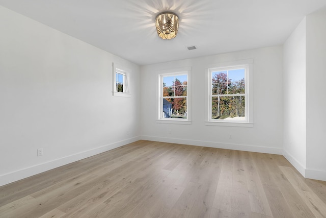 spare room featuring light hardwood / wood-style floors