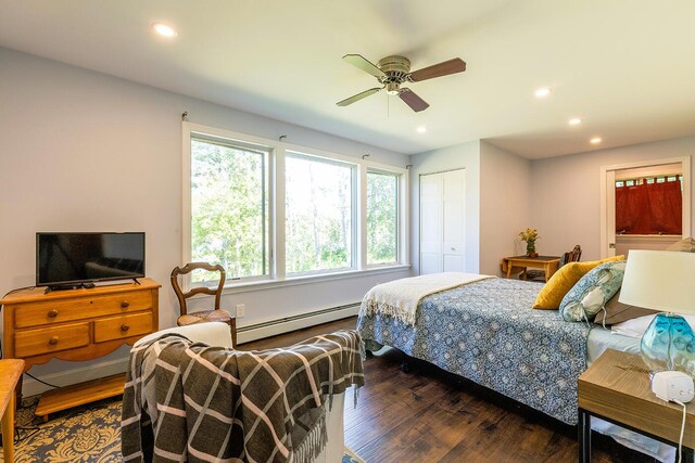 bedroom featuring ceiling fan, dark hardwood / wood-style floors, a closet, and a baseboard radiator