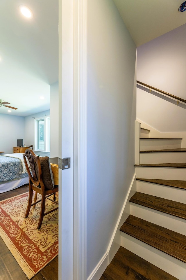 staircase featuring recessed lighting, ceiling fan, and wood finished floors