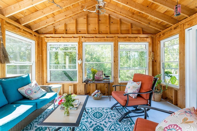 sunroom featuring lofted ceiling with beams and wooden ceiling