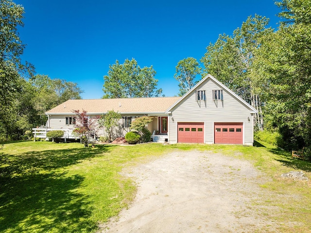 view of front of property with driveway and a front lawn