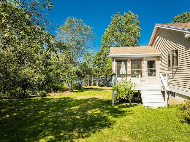 view of yard featuring a sunroom