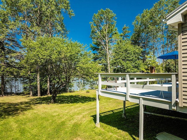 view of yard with a wooden deck