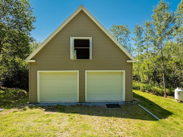 garage with a yard