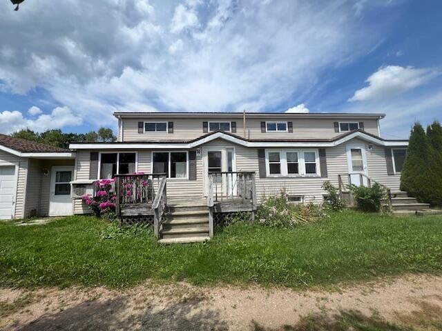 view of front of home with a wooden deck