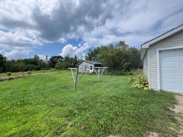 view of yard featuring a garage