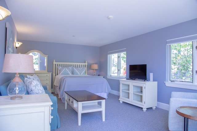 bedroom featuring light carpet