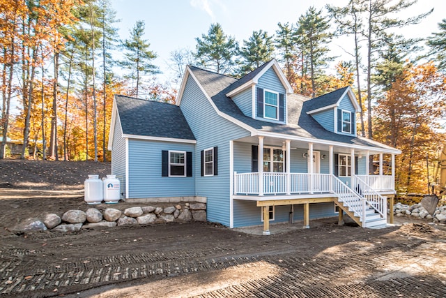 cape cod-style house featuring a porch