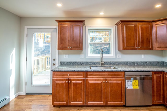 kitchen featuring dishwasher, sink, stone counters, a baseboard radiator, and light hardwood / wood-style floors