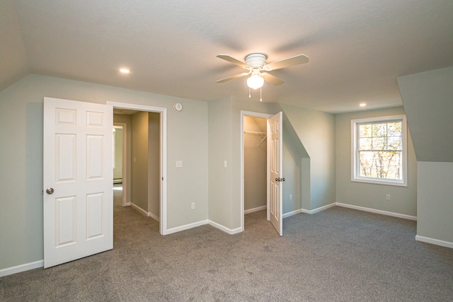 additional living space featuring ceiling fan, carpet flooring, and lofted ceiling