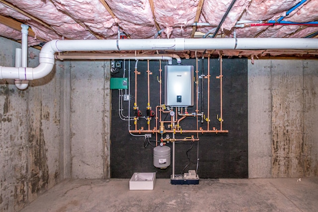 utility room featuring water heater