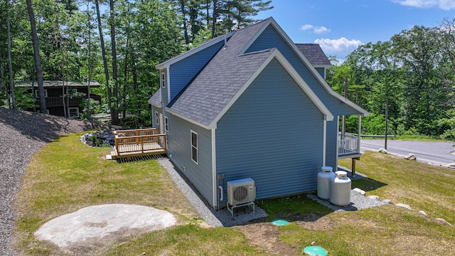 363 Main St, Fryeburg, ME 04037 - view of property exterior featuring a shingled roof, a lawn, and a wooden deck