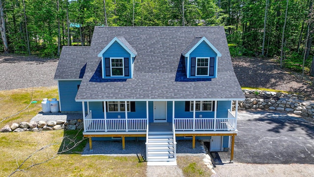 363 Main St, Fryeburg, ME 04037 - view of front of house with a shingled roof, covered porch, stairway, and a forest view