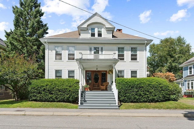 view of front facade featuring a balcony