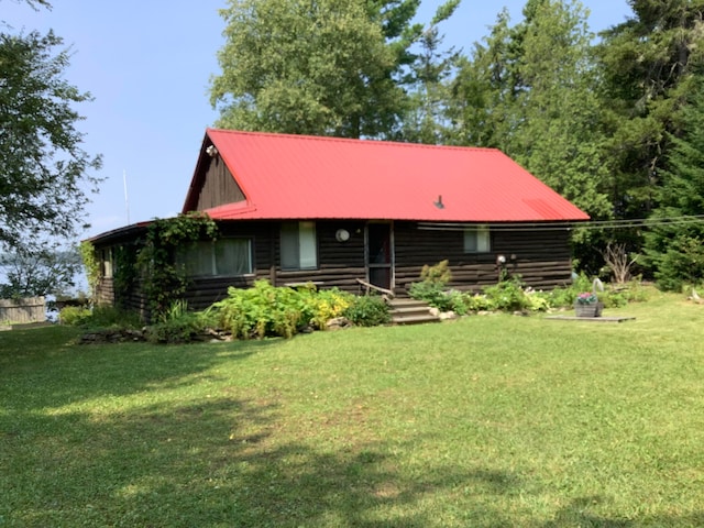 exterior space featuring a front lawn