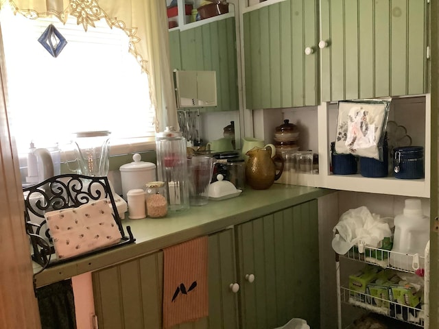 kitchen with green cabinetry