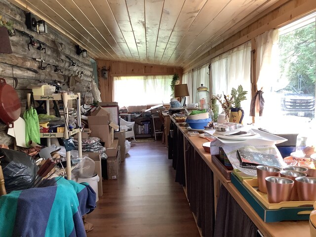 misc room with wooden ceiling, lofted ceiling, wood-type flooring, and wooden walls