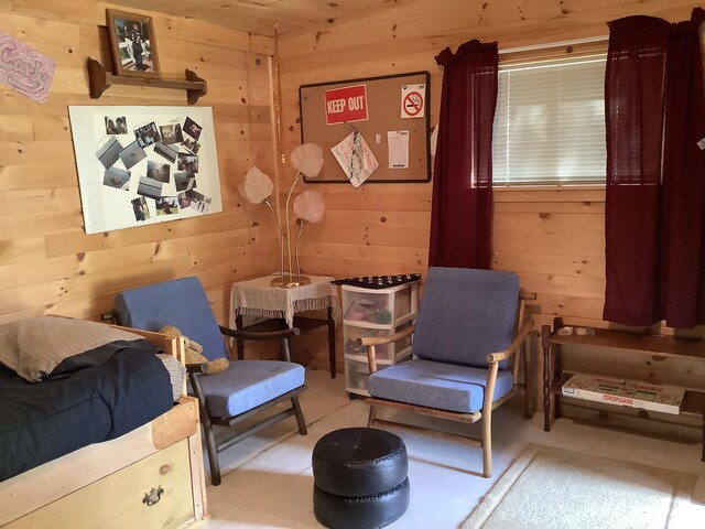 bedroom featuring wood walls