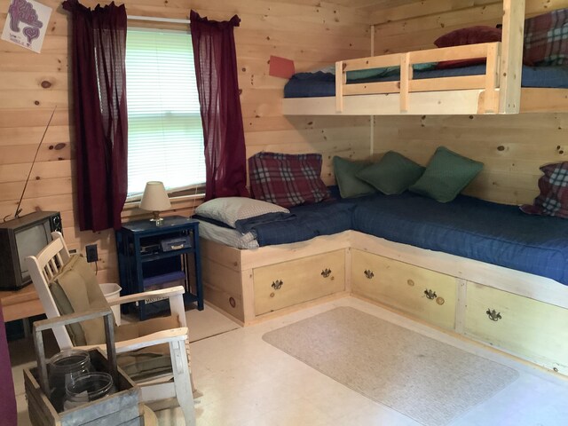 bedroom with wooden walls