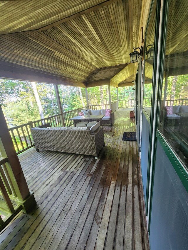 wooden deck with outdoor lounge area