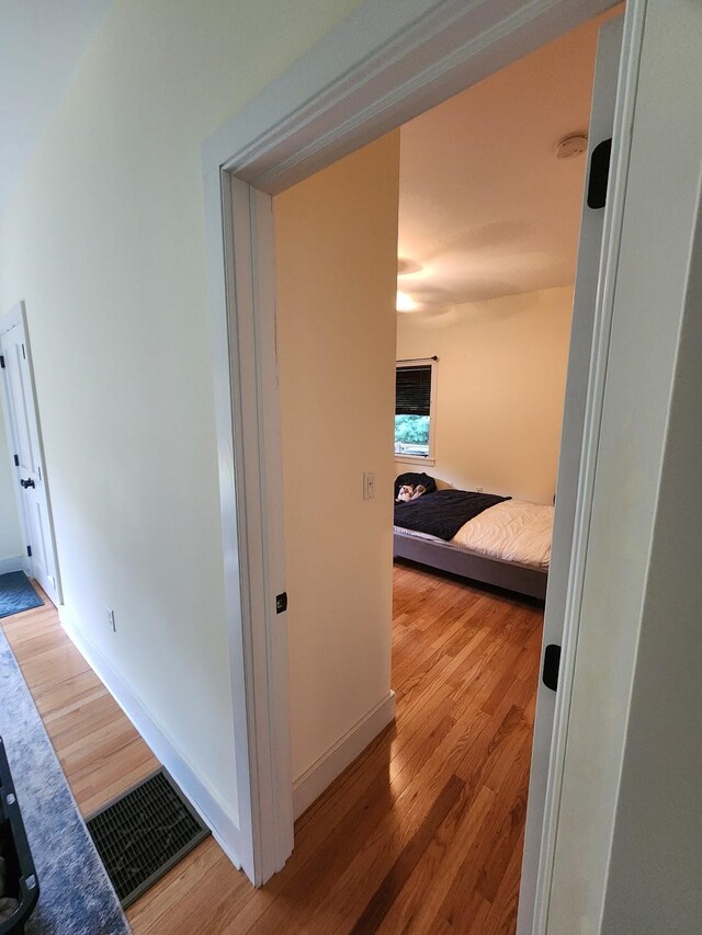 hallway featuring light wood-type flooring