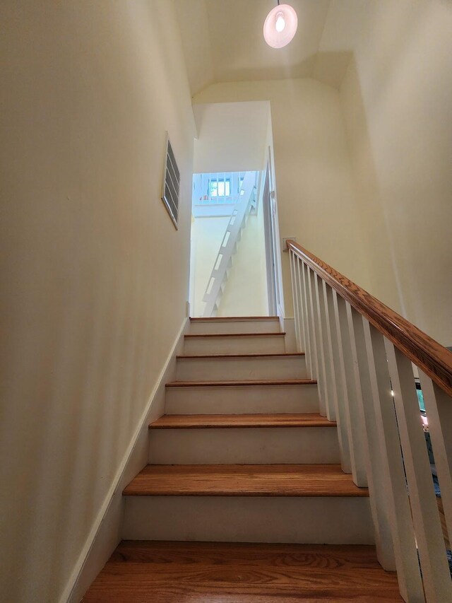 stairway with wood-type flooring