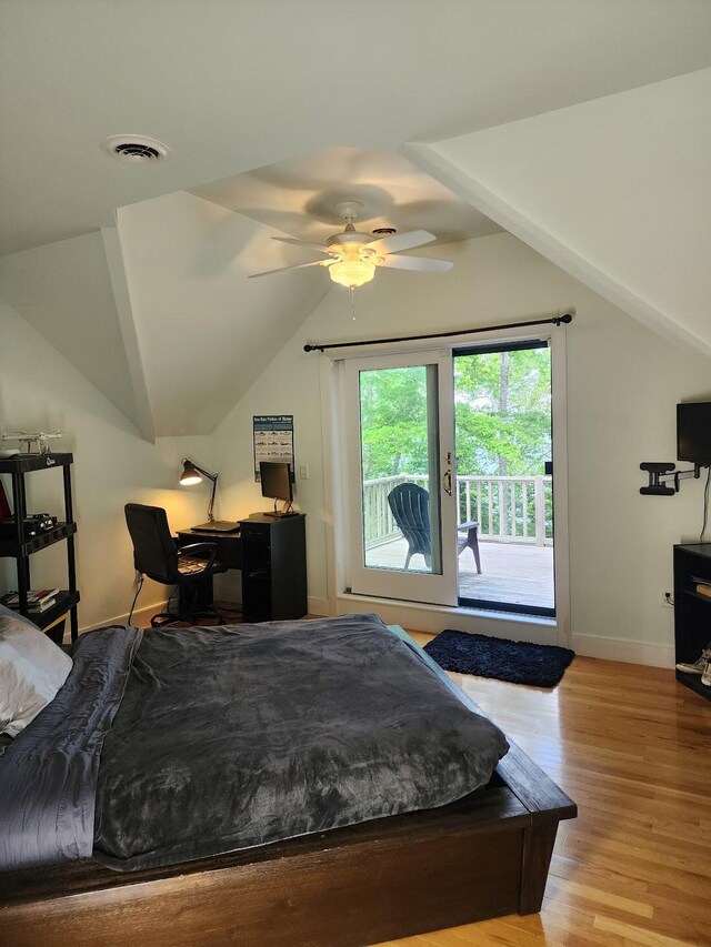 bedroom with vaulted ceiling, light hardwood / wood-style flooring, ceiling fan, and access to exterior