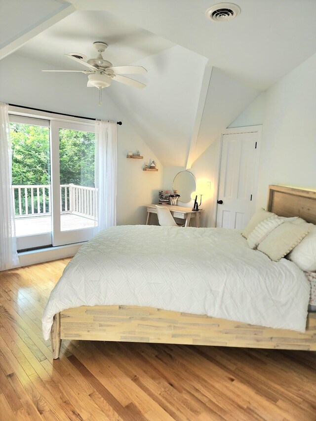 bedroom featuring lofted ceiling, access to exterior, light wood-type flooring, and ceiling fan