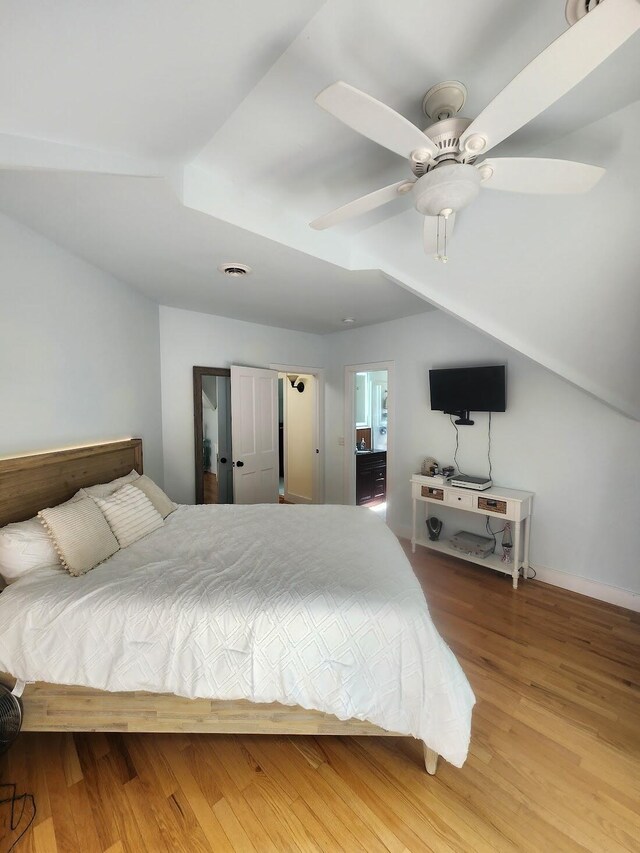 bedroom with ceiling fan and light hardwood / wood-style flooring