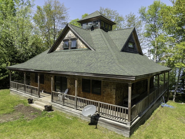166 Kingfisher Trl, Perry, ME 04667 - view of front of home with roof with shingles, a porch, and a front lawn