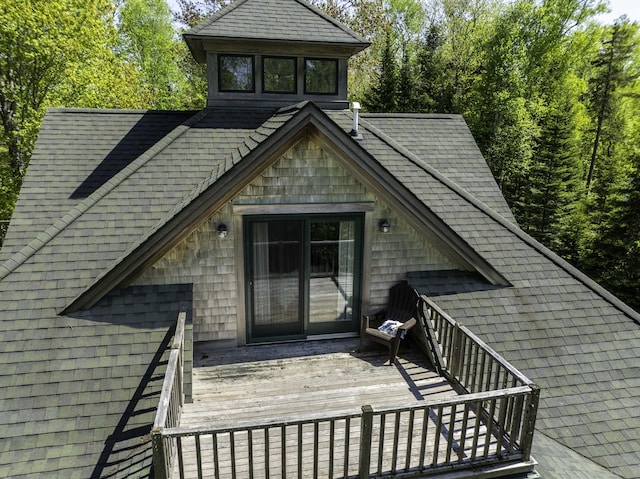 166 Kingfisher Trl, Perry, ME 04667 - view of exterior entry with a deck and a shingled roof
