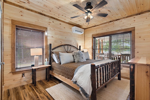 bedroom featuring hardwood / wood-style flooring, ceiling fan, wooden ceiling, wooden walls, and an AC wall unit