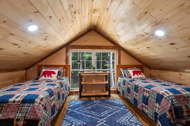 bedroom featuring hardwood / wood-style flooring, lofted ceiling, and wood ceiling