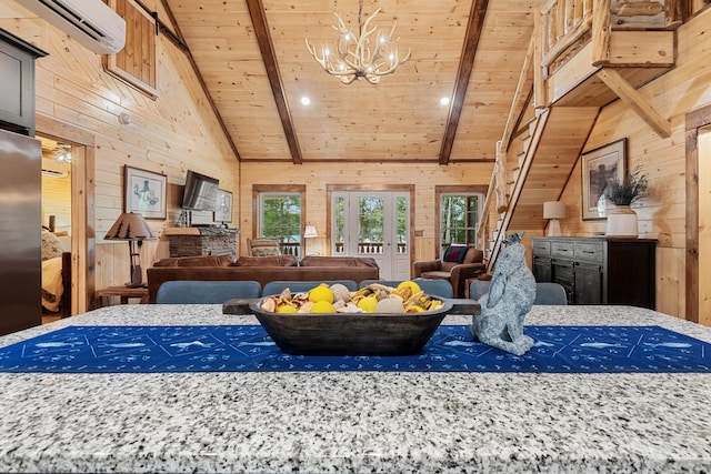 bedroom featuring a wall mounted AC, wood walls, and wooden ceiling