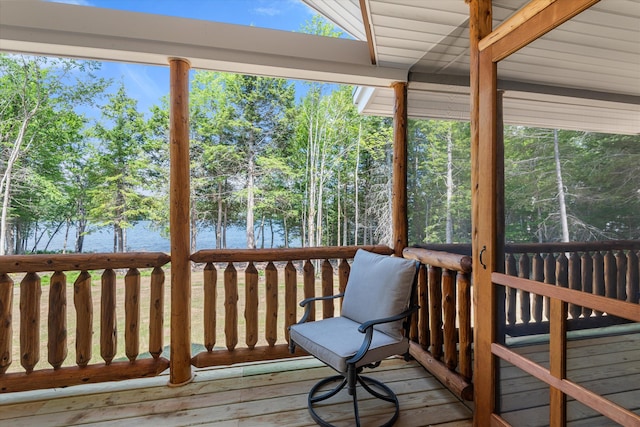 wooden deck featuring a water view