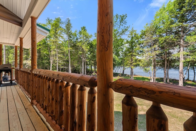 wooden terrace with a water view