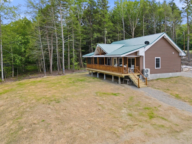 rear view of house with a yard