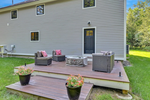 wooden deck featuring a yard and an outdoor hangout area