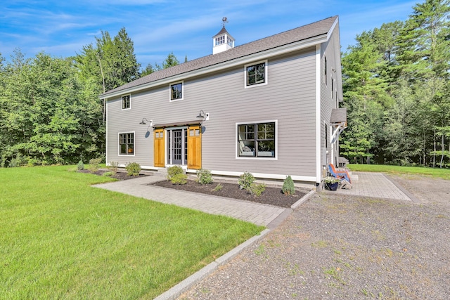 colonial home with a front yard