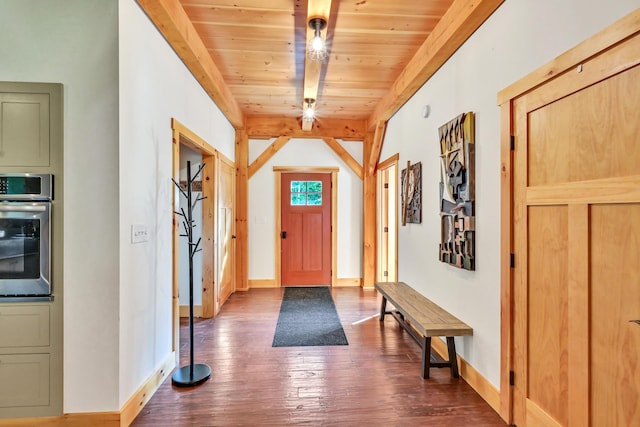 foyer with dark hardwood / wood-style floors, beam ceiling, and wooden ceiling