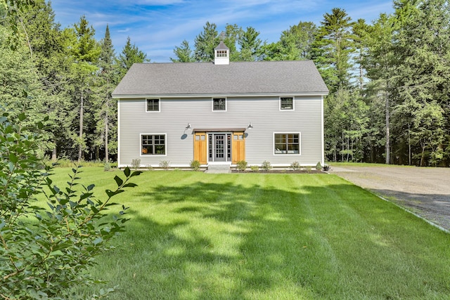 colonial inspired home with a front yard